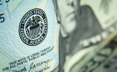 https://risk-commercial.eb8.infopro-insight.com/sites/default/files/2023-02/Federal-reserve-logo-on-US-banknote.jpg